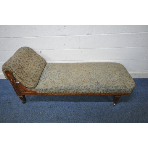 1330 - A LATE 19TH/EARLY 20TH CENTURY PITCH PINE CHAISE LOUNGE, with foliate upholstery, length 175cm x dep... 