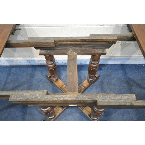 1208 - A FRENCH STYLE OAK EXTENDING DINING TABLE, with two additional leaves, raised on four turned legs, u... 