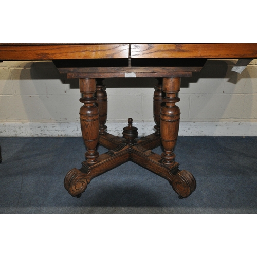 1208 - A FRENCH STYLE OAK EXTENDING DINING TABLE, with two additional leaves, raised on four turned legs, u... 