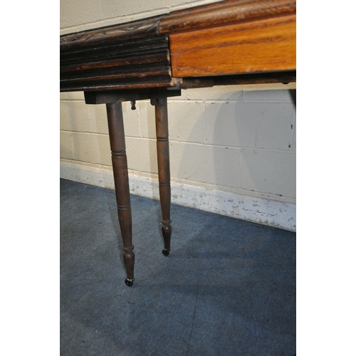 1208 - A FRENCH STYLE OAK EXTENDING DINING TABLE, with two additional leaves, raised on four turned legs, u... 