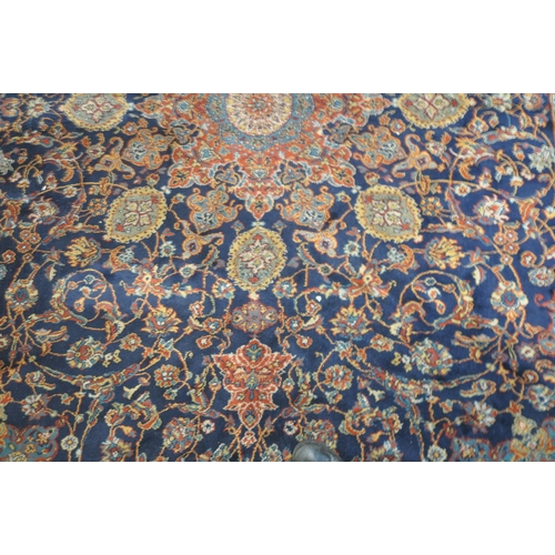 1224 - A 20TH CENTURY WOOLEN RUG, with repeating foliate design, central medallion, within a blue field, su... 