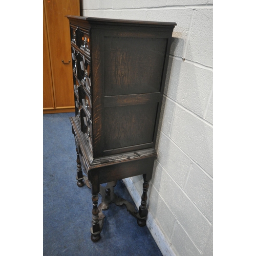 1225 - AN EARLY 20TH CENTURY JACOBEAN STYLE CHEST ON STAND, fitted with five drawers with various geometric... 