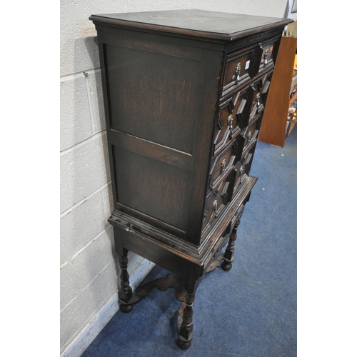 1225 - AN EARLY 20TH CENTURY JACOBEAN STYLE CHEST ON STAND, fitted with five drawers with various geometric... 