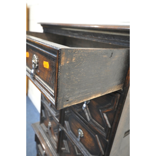 1225 - AN EARLY 20TH CENTURY JACOBEAN STYLE CHEST ON STAND, fitted with five drawers with various geometric... 