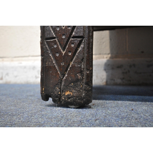 1226 - A 16TH/17TH CENTURY OAK PANELLED COFFER, with geometric pattern and repeating symbols, width 109cm x... 