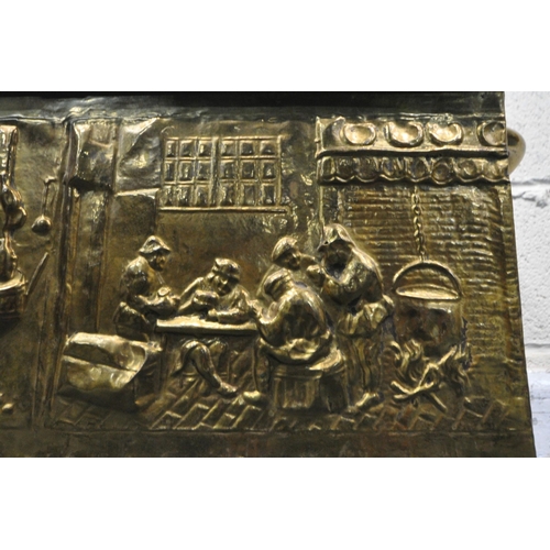 1227 - A 20TH CENTURY LOG BOX, the pressed brass depicting a variety of people, horses and buildings, with ... 