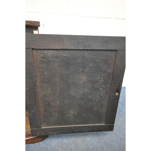 1229 - A GEORGIAN OAK HANGING CORNER CUPBOARD, with a later mahogany door panel depicting fleur de lis, qua... 