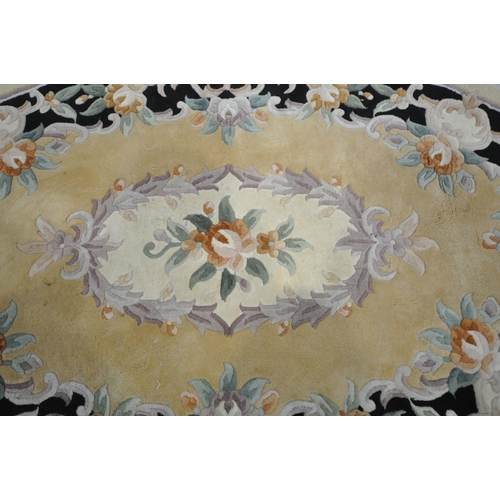 1239 - A YELLOW GROUND CHINESE WOOLEN RUG, with floral medallion and border, 163cm x 103cm (condition repor... 