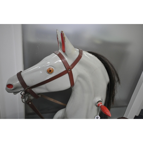 1240 - A RAGAMUFFIN TOYS LTD ROCKING HORSE, the grey and black spotty painted fibreglass leaping horse moun... 