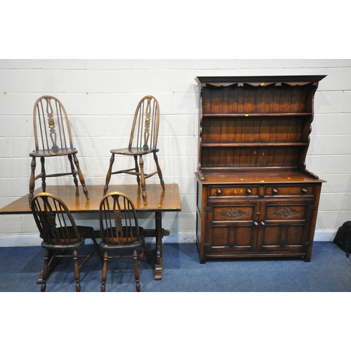 1244 - A GOOD QUALITY REPRODUCTION OAK DRESSER, the top with a two tier plate rack, the base fitted with tw... 