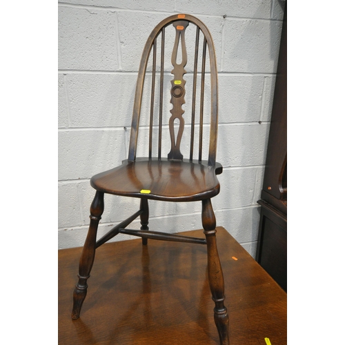 1244 - A GOOD QUALITY REPRODUCTION OAK DRESSER, the top with a two tier plate rack, the base fitted with tw... 