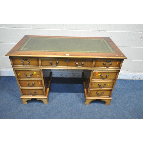 1245 - A 20TH CENTURY YEW WOOD TWIN PEDESTAL DESK, with green tooled leather writing surface, fitted with a... 