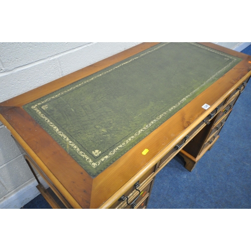 1245 - A 20TH CENTURY YEW WOOD TWIN PEDESTAL DESK, with green tooled leather writing surface, fitted with a... 