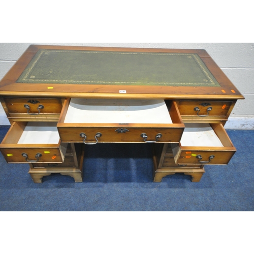 1245 - A 20TH CENTURY YEW WOOD TWIN PEDESTAL DESK, with green tooled leather writing surface, fitted with a... 