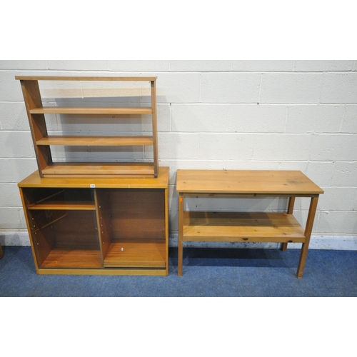 1248 - A MID CENTURY TEAK BOOKCASE, with double glazed sliding doors, enclosing four adjustable shelves, wi... 