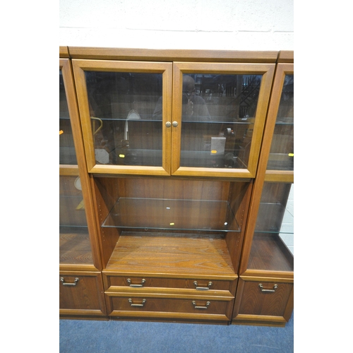 1250 - A MID CENTURY G PLAN TEAK WALL CABINET, comprising three sections, one section with double glazed do... 