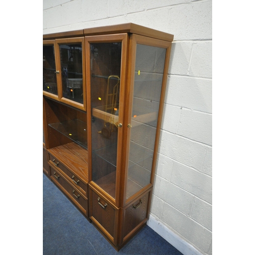 1250 - A MID CENTURY G PLAN TEAK WALL CABINET, comprising three sections, one section with double glazed do... 