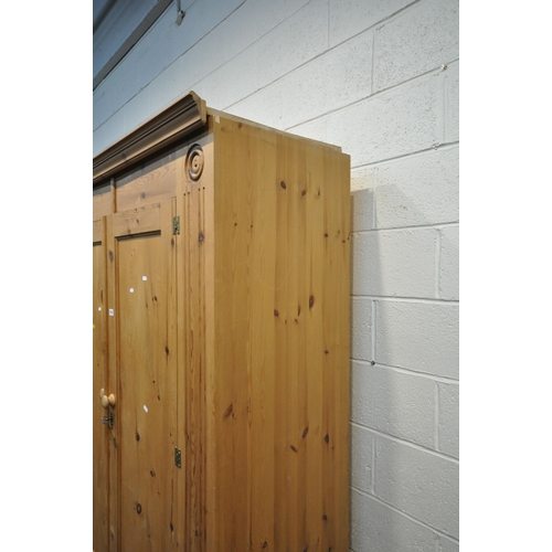 1251 - A 20TH CENTURY PINE DOUBLE DOOR WARDROBE, with two drawers, width 145cm x depth 56cm x height 203cm ... 