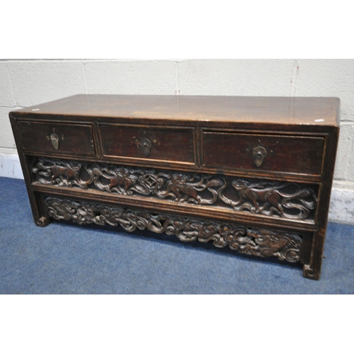 1252 - A 19TH CENTURY CHINESE HUANGHUALI LOW CABINET, fitted with three drawers, enclosing a further hidden... 