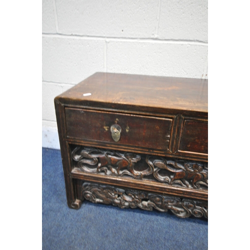 1252 - A 19TH CENTURY CHINESE HUANGHUALI LOW CABINET, fitted with three drawers, enclosing a further hidden... 