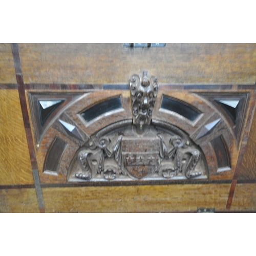 1253 - A SMALL GEORGIAN AND LATER OAK AND INLAID MULE CHEST, the inner lid depicting a carved coat of arms,... 