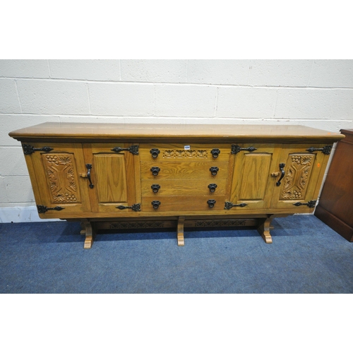 1254 - A WEBBER FURNITURE CROYDON RANGE OAK SIDEBOARD, fitted with four drawers, flanked by double doors, o... 