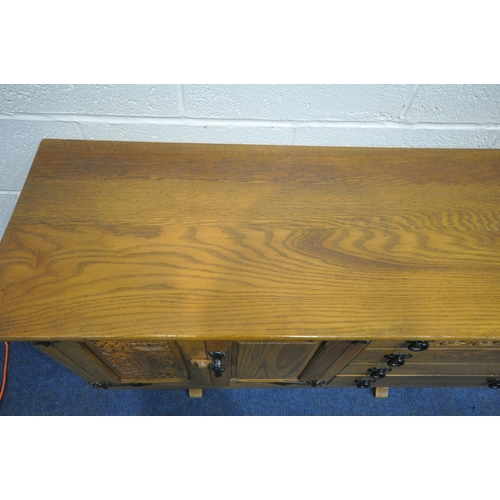 1254 - A WEBBER FURNITURE CROYDON RANGE OAK SIDEBOARD, fitted with four drawers, flanked by double doors, o... 