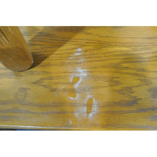 1257 - A 20TH CENTURY OAK RECTANGULAR DINING TABLE, with twin trestle legs, united by a stretcher, length 1... 