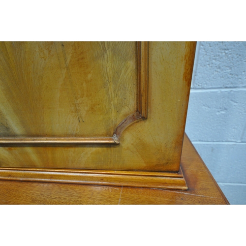 1259 - A 20TH CENTURY WALNUT BOOKCASE, the top section with two cupboard doors, flanking double glazed door... 