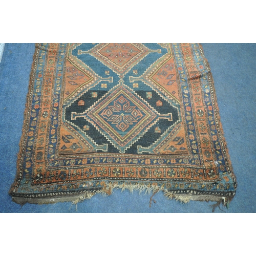 1265 - A HAND WOVEN WOOL CARPET RUNNER, with a six medallions, within a blue field and multi strap border, ... 