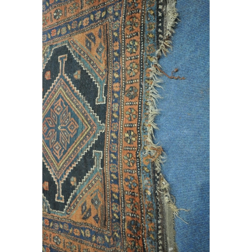 1265 - A HAND WOVEN WOOL CARPET RUNNER, with a six medallions, within a blue field and multi strap border, ... 