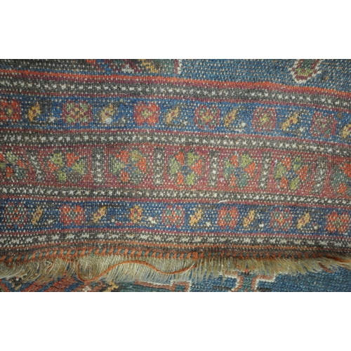 1265 - A HAND WOVEN WOOL CARPET RUNNER, with a six medallions, within a blue field and multi strap border, ... 