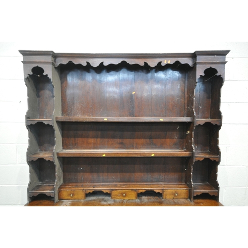 1269 - A GEORGIAN OAK DRESSER BASE, fitted with an arrangement of six drawers and two storage sections, wit... 