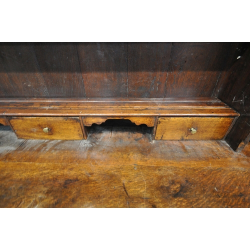 1269 - A GEORGIAN OAK DRESSER BASE, fitted with an arrangement of six drawers and two storage sections, wit... 