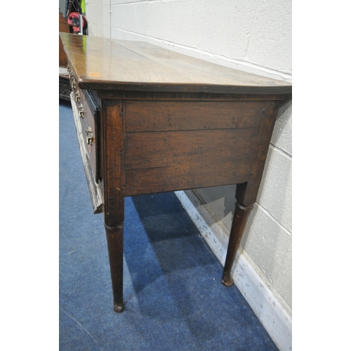 1272 - A GEORGIAN OAK DRESSER BASE, with three deep drawers, on cylindrical tapered legs and padded feet, l... 