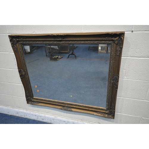 1276 - A LARGE RECTANGULAR GILT FRAME BEVELLED EDGE WALL MIRROR, with filiate detail, 122cm x 97cm (conditi... 