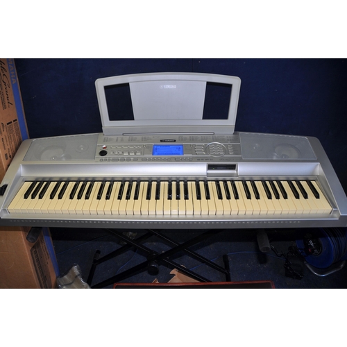 1052 - A YAMAHA DGX-300 PORTABLE GRAND ELECTRONIC KEYBOARD with power supply, stand, original box, cover, m... 