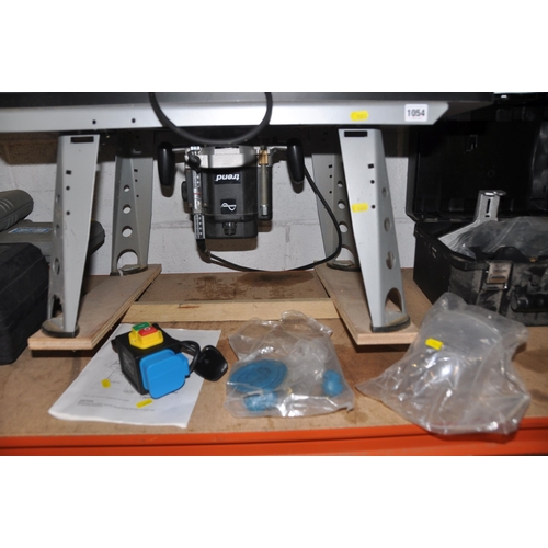 1054 - A MAKITA ROUTER TABLE 490 with a Trend 1/2in router and case and a Trend respirator screen (PAT pass... 