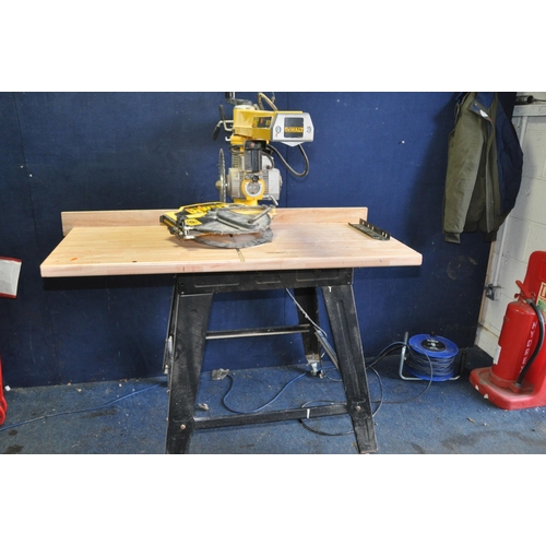 1055 - A DeWALT DW721 RADIAL ARM SAW ON STAND with blade guard removed due to oversized blade being fitted ... 