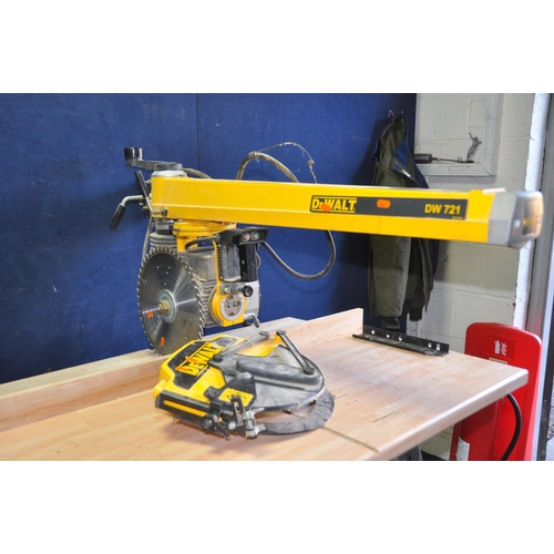 1055 - A DeWALT DW721 RADIAL ARM SAW ON STAND with blade guard removed due to oversized blade being fitted ... 