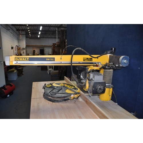 1055 - A DeWALT DW721 RADIAL ARM SAW ON STAND with blade guard removed due to oversized blade being fitted ... 