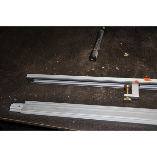 1068 - A PAIR OF ROLLER STANDS and a carpenters straight edge guide with two clamps 286cm long in total and... 