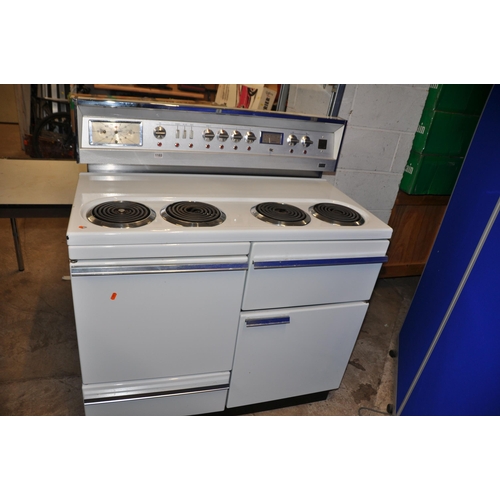 1103 - A VINTAGE G.E.C. ELECTRIC RANGE COOKER with four top rings, two oven, one grill and drawer width 107... 