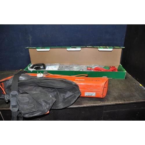 1111 - A GARDENLINE ELECTRIC POLE HEDGE TRIMMER (still packaged and new) and a Flymo garden vac (untested)