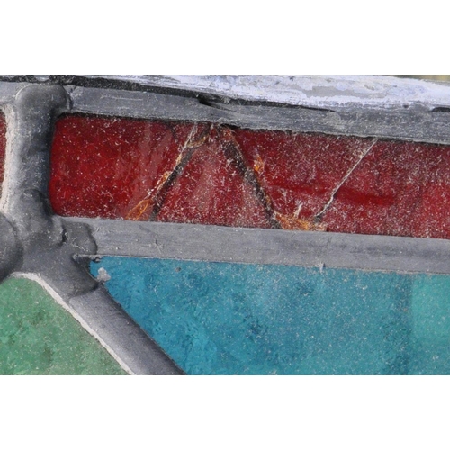 1278 - AN OPPOSING PAIR OF LEAD GLAZED WINDOWS, with red border, surrounding  multi-coloured panes, with a ... 