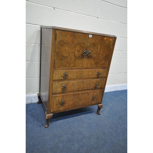 1280 - A 20TH CENTURY WALNUT TALLBOY, with double cupboard doors, above three graduated drawers, on cabriol... 