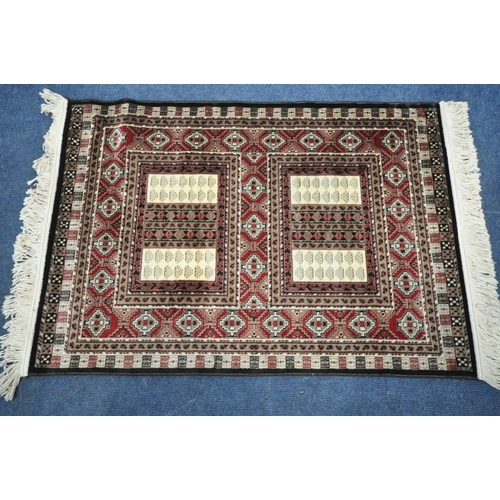 1284 - A SMALL RECTANGULAR ISPHAHAN SILK RUG, with a variety of repeating geometric patterns, 105cm x 73cm ... 