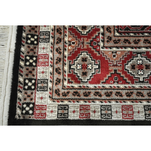 1284 - A SMALL RECTANGULAR ISPHAHAN SILK RUG, with a variety of repeating geometric patterns, 105cm x 73cm ... 