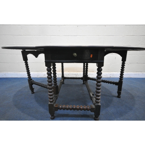 1286 - A GEORGIAN OAK OVAL BOBBIN TURNED GATE LEG TABLE, with a single drawer to each end, open width 182cm... 