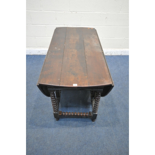 1286 - A GEORGIAN OAK OVAL BOBBIN TURNED GATE LEG TABLE, with a single drawer to each end, open width 182cm... 